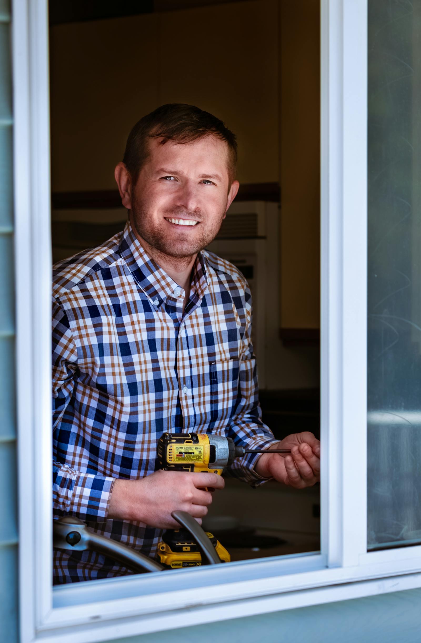 A friendly, licensed handyman from Austin Handyman Pros ready to start a job